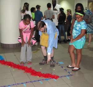 Nels Johnson (center) helps students interpret their Eastern Bluebird population graph.